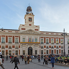 MADRID, SPAIN - JANUARY 23, 2018:  Sunset view of walking people at Puerta del Sol in Madrid, Spain