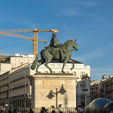 MADRID, SPAIN - JANUARY 23, 2018:  Sunset view of walking people at Puerta del Sol in Madrid, Spain