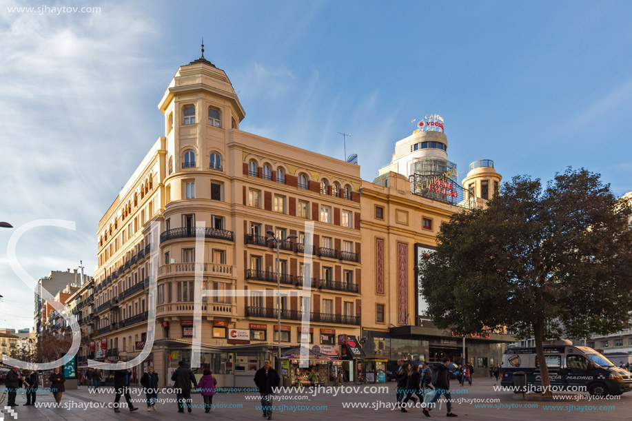 MADRID, SPAIN - JANUARY 23, 2018: Sunset view of walking people at Callao Square (Plaza del Callao) in City of Madrid, Spain