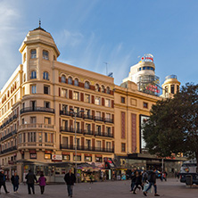 MADRID, SPAIN - JANUARY 23, 2018: Sunset view of walking people at Callao Square (Plaza del Callao) in City of Madrid, Spain