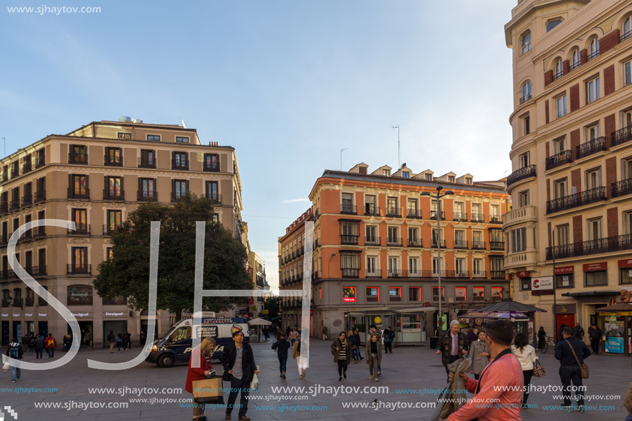 MADRID, SPAIN - JANUARY 23, 2018: Sunset view of walking people at Callao Square (Plaza del Callao) in City of Madrid, Spain