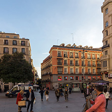 MADRID, SPAIN - JANUARY 23, 2018: Sunset view of walking people at Callao Square (Plaza del Callao) in City of Madrid, Spain