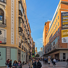 MADRID, SPAIN - JANUARY 23, 2018: Sunset view of walking people at Callao Square (Plaza del Callao) in City of Madrid, Spain