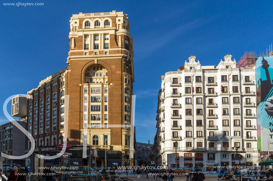 MADRID, SPAIN - JANUARY 23, 2018: Sunset view of walking people at Callao Square (Plaza del Callao) in City of Madrid, Spain