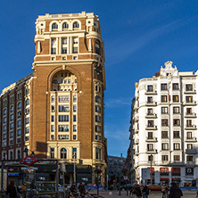 MADRID, SPAIN - JANUARY 23, 2018: Sunset view of walking people at Callao Square (Plaza del Callao) in City of Madrid, Spain