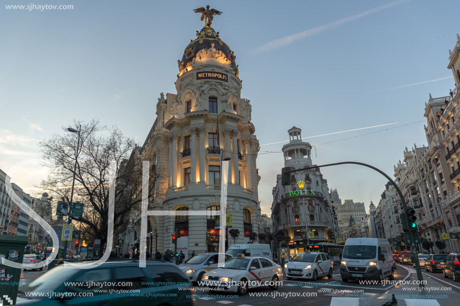 MADRID, SPAIN - JANUARY 23, 2018:  Sunset view of Gran Via and Metropolis Building (Edificio Metropolis) in City of Madrid, Spain