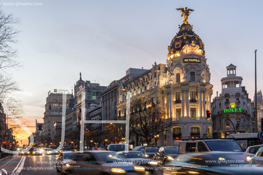 MADRID, SPAIN - JANUARY 23, 2018:  Sunset view of Gran Via and Metropolis Building (Edificio Metropolis) in City of Madrid, Spain