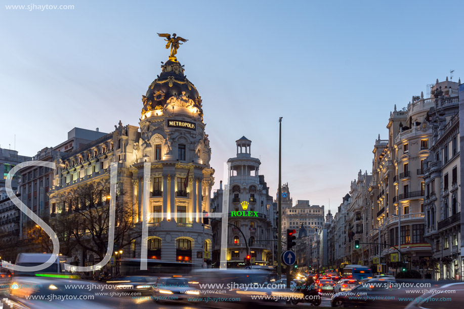 MADRID, SPAIN - JANUARY 23, 2018:  Sunset view of Gran Via and Metropolis Building (Edificio Metropolis) in City of Madrid, Spain