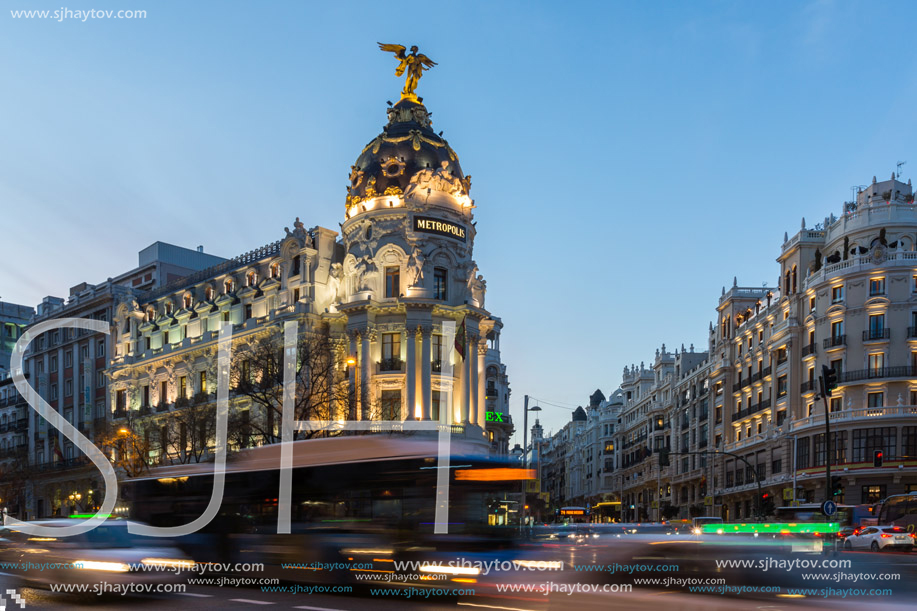 MADRID, SPAIN - JANUARY 23, 2018:  Sunset view of Gran Via and Metropolis Building (Edificio Metropolis) in City of Madrid, Spain