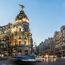 MADRID, SPAIN - JANUARY 23, 2018:  Sunset view of Gran Via and Metropolis Building (Edificio Metropolis) in City of Madrid, Spain