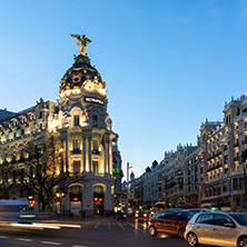 MADRID, SPAIN - JANUARY 23, 2018:  Sunset view of Gran Via and Metropolis Building (Edificio Metropolis) in City of Madrid, Spain