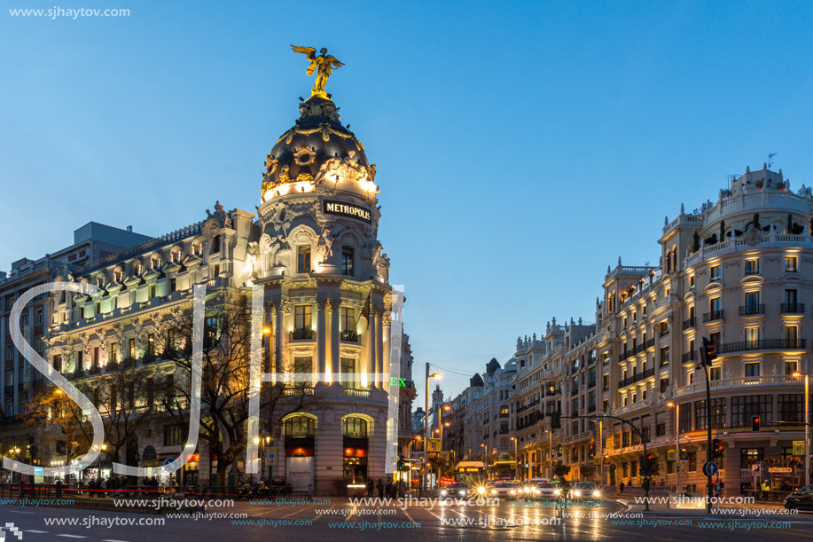 MADRID, SPAIN - JANUARY 23, 2018:  Sunset view of Gran Via and Metropolis Building (Edificio Metropolis) in City of Madrid, Spain