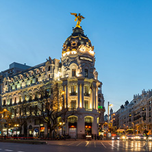 MADRID, SPAIN - JANUARY 23, 2018:  Sunset view of Gran Via and Metropolis Building (Edificio Metropolis) in City of Madrid, Spain