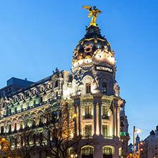 MADRID, SPAIN - JANUARY 23, 2018:  Sunset view of Gran Via and Metropolis Building (Edificio Metropolis) in City of Madrid, Spain