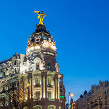 MADRID, SPAIN - JANUARY 23, 2018:  Sunset view of Gran Via and Metropolis Building (Edificio Metropolis) in City of Madrid, Spain