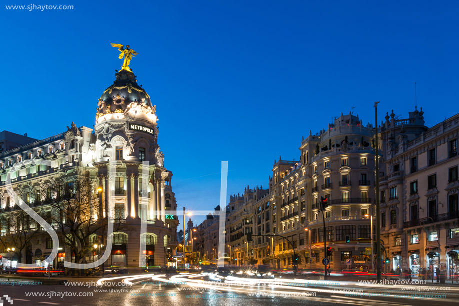 MADRID, SPAIN - JANUARY 23, 2018:  Sunset view of Gran Via and Metropolis Building (Edificio Metropolis) in City of Madrid, Spain