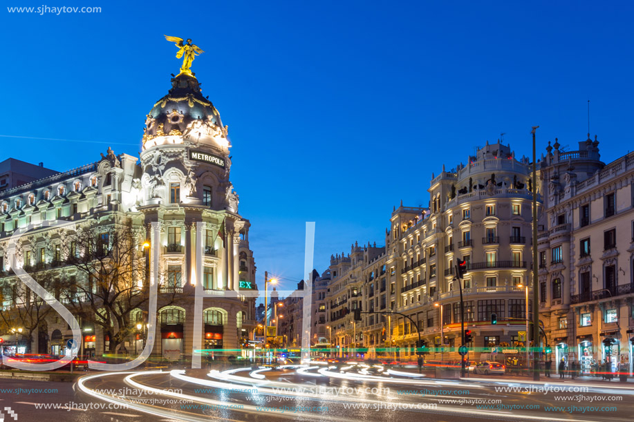 MADRID, SPAIN - JANUARY 23, 2018:  Sunset view of Gran Via and Metropolis Building (Edificio Metropolis) in City of Madrid, Spain