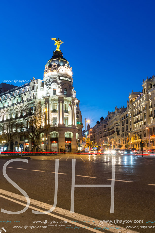 MADRID, SPAIN - JANUARY 23, 2018:  Sunset view of Gran Via and Metropolis Building (Edificio Metropolis) in City of Madrid, Spain