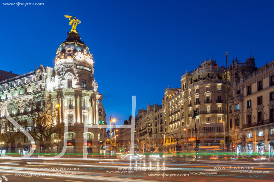 MADRID, SPAIN - JANUARY 23, 2018:  Sunset view of Gran Via and Metropolis Building (Edificio Metropolis) in City of Madrid, Spain