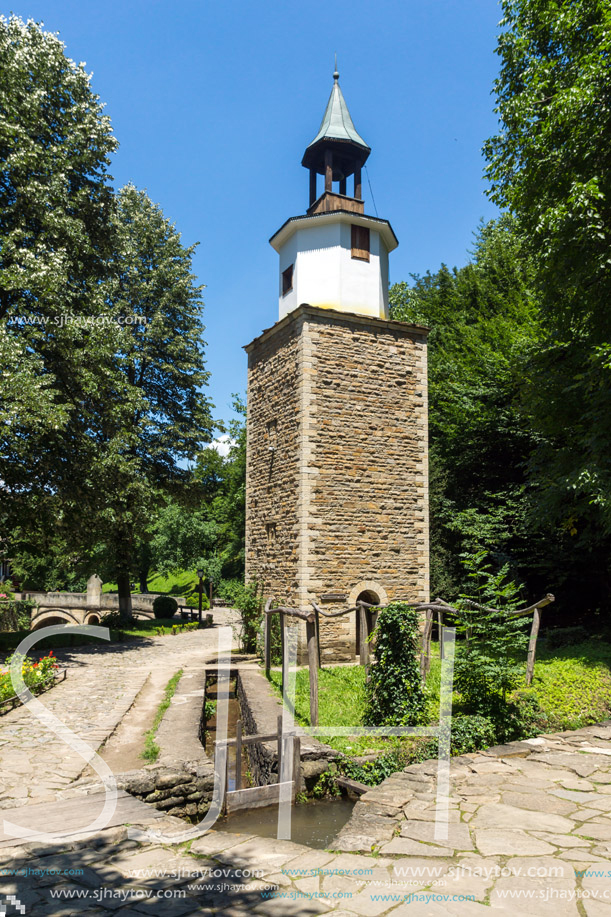 ETAR, GABROVO, BULGARIA- JULY 6, 2018: Clock tower in Architectural Ethnographic Complex Etar (Etara) near town of Gabrovo, Bulgaria