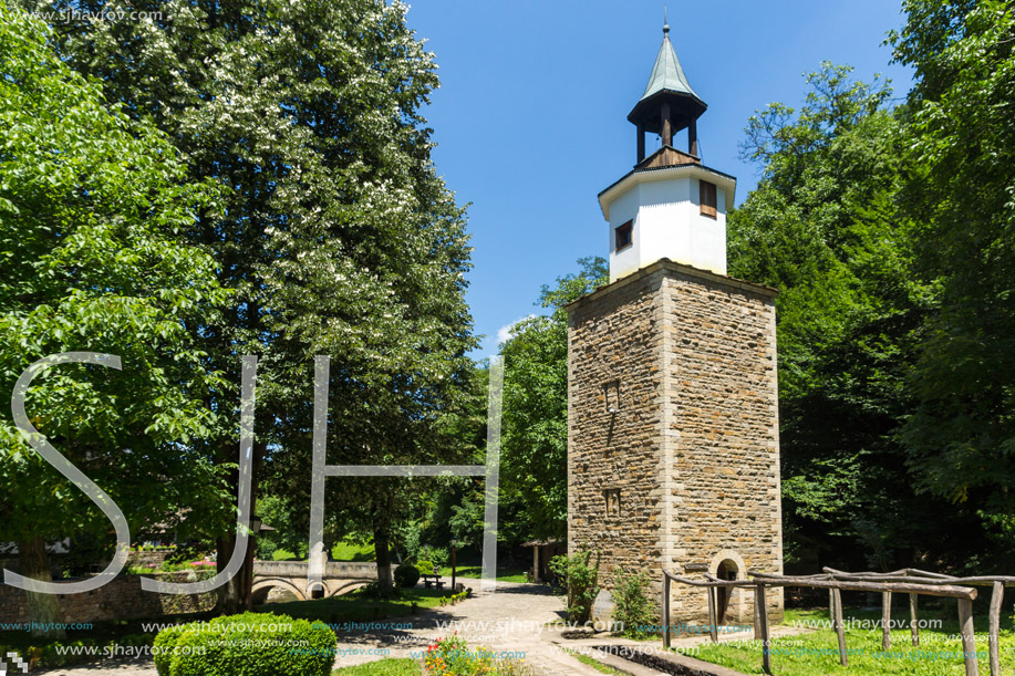 ETAR, GABROVO, BULGARIA- JULY 6, 2018: Clock tower in Architectural Ethnographic Complex Etar (Etara) near town of Gabrovo, Bulgaria