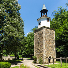 ETAR, GABROVO, BULGARIA- JULY 6, 2018: Clock tower in Architectural Ethnographic Complex Etar (Etara) near town of Gabrovo, Bulgaria