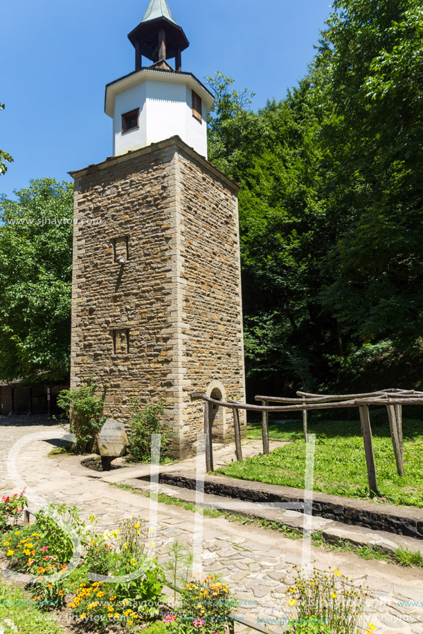 ETAR, GABROVO, BULGARIA- JULY 6, 2018: Clock tower in Architectural Ethnographic Complex Etar (Etara) near town of Gabrovo, Bulgaria