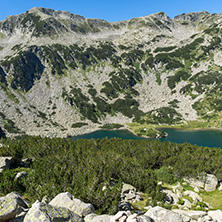 Landscape with green hills and Banderitsa fish lake, Pirin Mountain, Bulgaria