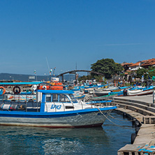 NESSEBAR, BULGARIA - AUGUST 12, 2018: Panorama with fishing boat at The Port of Nessebar, Burgas Region, Bulgaria