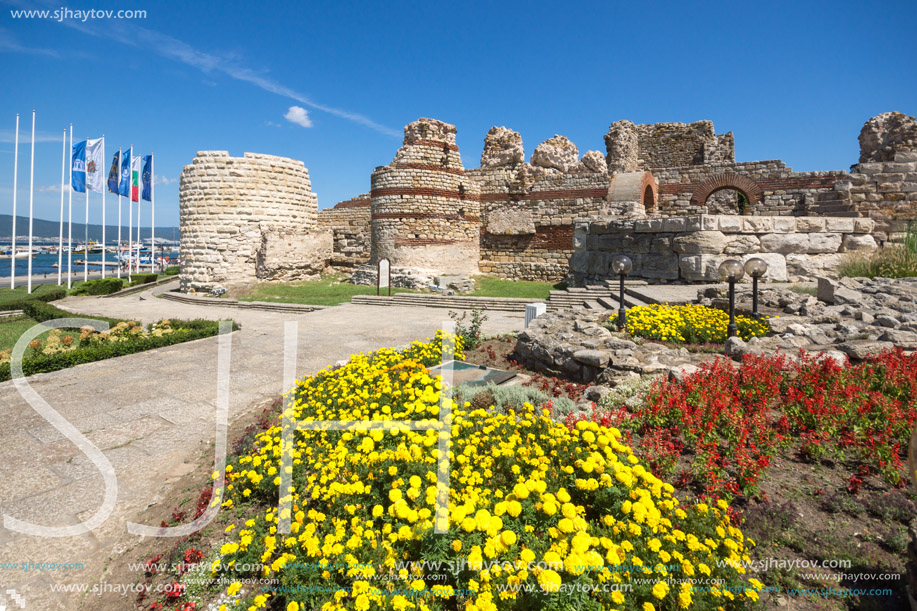 NESSEBAR, BULGARIA - AUGUST 12, 2018: Tourist visiting ruins of Ancient Fortifications at the entrance of old town of Nessebar, Burgas Region, Bulgaria