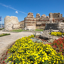 NESSEBAR, BULGARIA - AUGUST 12, 2018: Tourist visiting ruins of Ancient Fortifications at the entrance of old town of Nessebar, Burgas Region, Bulgaria