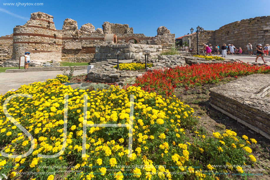 NESSEBAR, BULGARIA - AUGUST 12, 2018: Tourist visiting ruins of Ancient Fortifications at the entrance of old town of Nessebar, Burgas Region, Bulgaria