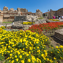 NESSEBAR, BULGARIA - AUGUST 12, 2018: Tourist visiting ruins of Ancient Fortifications at the entrance of old town of Nessebar, Burgas Region, Bulgaria