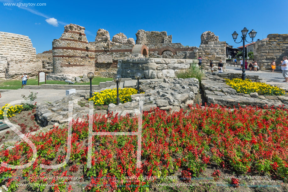 NESSEBAR, BULGARIA - AUGUST 12, 2018: Tourist visiting ruins of Ancient Fortifications at the entrance of old town of Nessebar, Burgas Region, Bulgaria