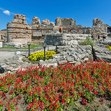 NESSEBAR, BULGARIA - AUGUST 12, 2018: Tourist visiting ruins of Ancient Fortifications at the entrance of old town of Nessebar, Burgas Region, Bulgaria