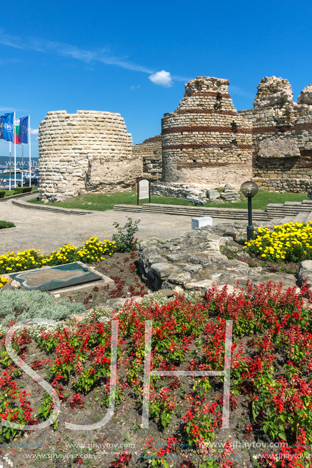NESSEBAR, BULGARIA - AUGUST 12, 2018: Tourist visiting ruins of Ancient Fortifications at the entrance of old town of Nessebar, Burgas Region, Bulgaria