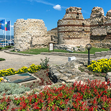 NESSEBAR, BULGARIA - AUGUST 12, 2018: Tourist visiting ruins of Ancient Fortifications at the entrance of old town of Nessebar, Burgas Region, Bulgaria