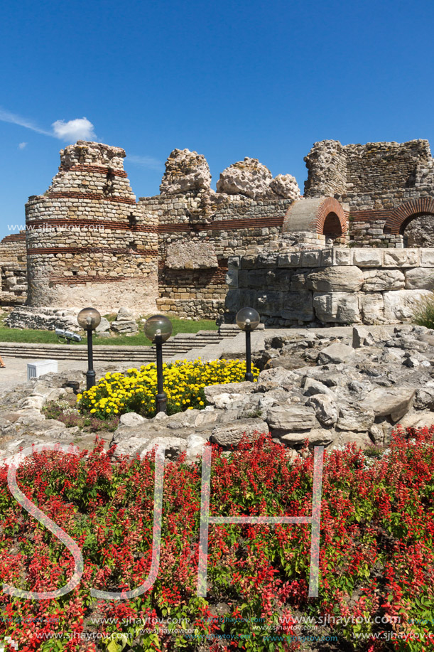 NESSEBAR, BULGARIA - AUGUST 12, 2018: Tourist visiting ruins of Ancient Fortifications at the entrance of old town of Nessebar, Burgas Region, Bulgaria