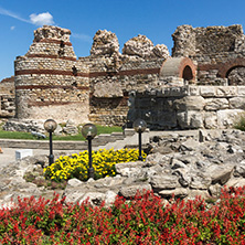 NESSEBAR, BULGARIA - AUGUST 12, 2018: Tourist visiting ruins of Ancient Fortifications at the entrance of old town of Nessebar, Burgas Region, Bulgaria