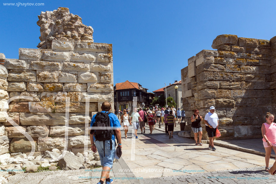 NESSEBAR, BULGARIA - AUGUST 12, 2018: Tourist visiting ruins of Ancient Fortifications at the entrance of old town of Nessebar, Burgas Region, Bulgaria