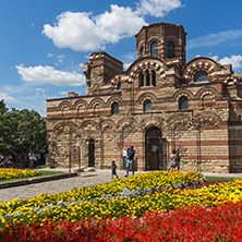 NESSEBAR, BULGARIA - AUGUST 12, 2018: Flower garden in front of Ancient Church of Christ Pantocrator in the town of Nessebar, Burgas Region, Bulgaria