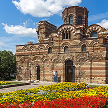 NESSEBAR, BULGARIA - AUGUST 12, 2018: Flower garden in front of Ancient Church of Christ Pantocrator in the town of Nessebar, Burgas Region, Bulgaria