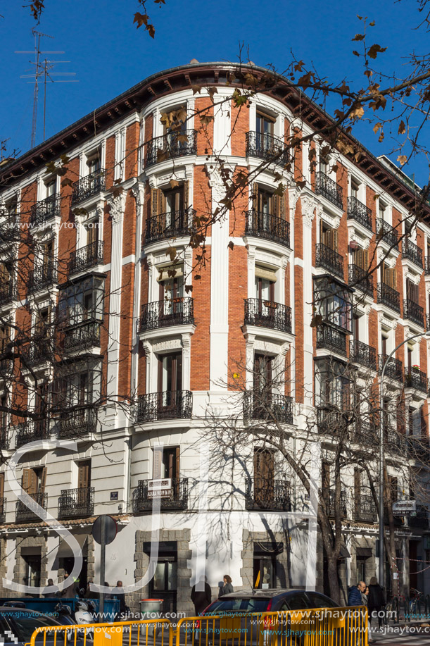 MADRID, SPAIN - JANUARY 24, 2018: Facade of typical Buildings and streets in City of Madrid, Spain