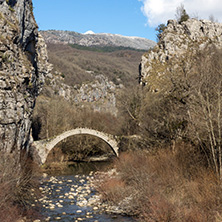 Landscape of Ancient Bridge of Kontodimos or Lazaridis in Vikos gorge and Pindus Mountains, Zagori, Epirus, Greece