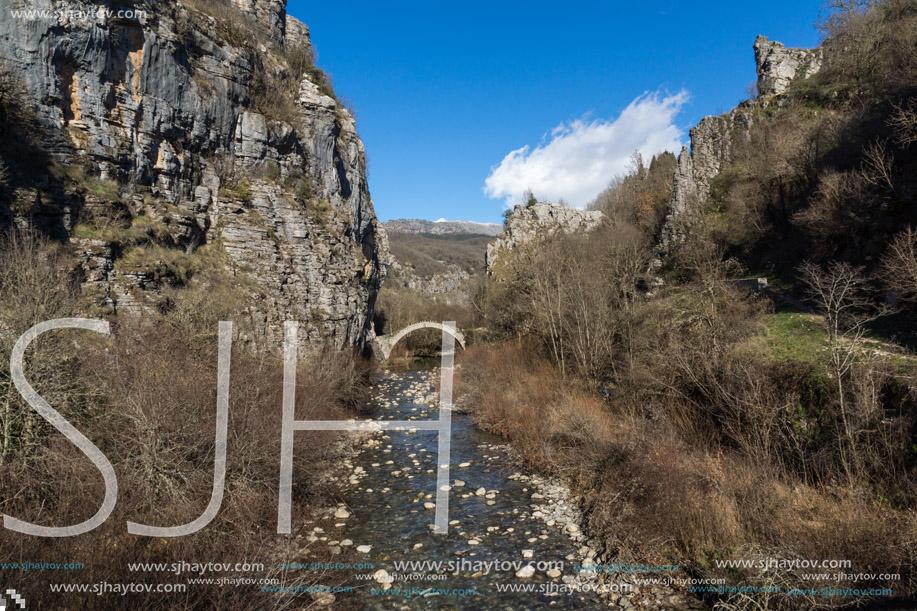 Landscape of Ancient Bridge of Kontodimos or Lazaridis in Vikos gorge and Pindus Mountains, Zagori, Epirus, Greece