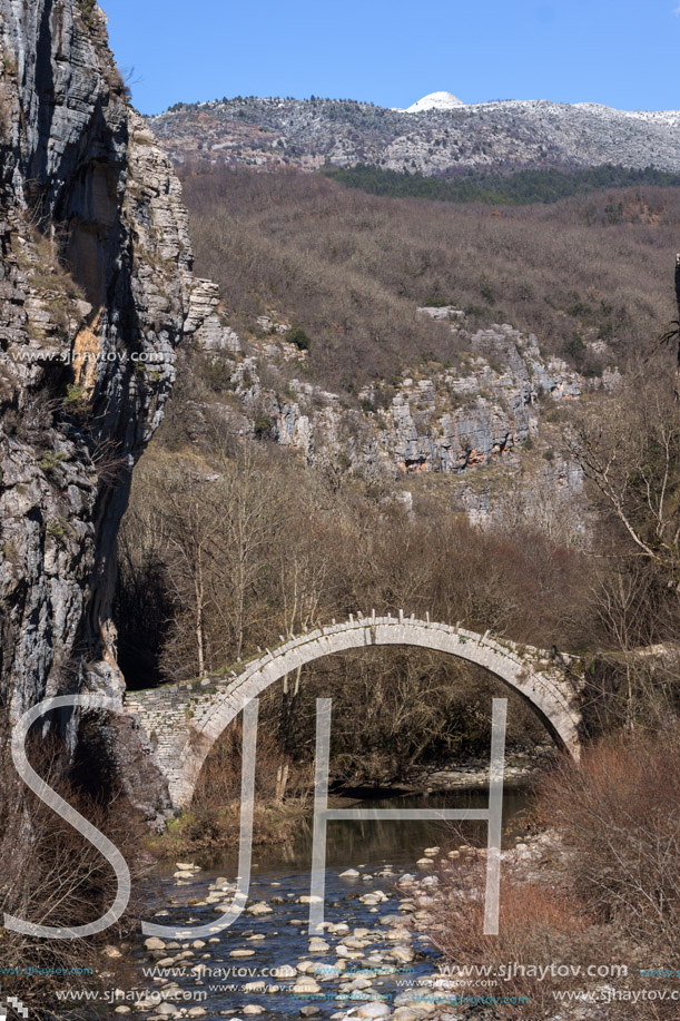 Landscape of Ancient Bridge of Kontodimos or Lazaridis in Vikos gorge and Pindus Mountains, Zagori, Epirus, Greece