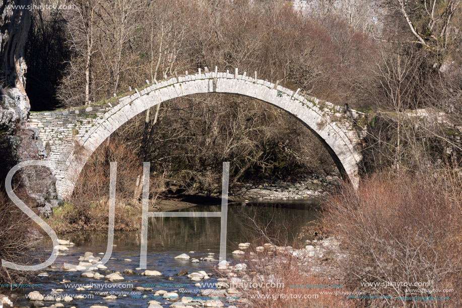 Landscape of Ancient Bridge of Kontodimos or Lazaridis in Vikos gorge and Pindus Mountains, Zagori, Epirus, Greece