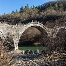 Landscape of Ancient Bridge of Missios in Vikos gorge and Pindus Mountains, Zagori, Epirus, Greece