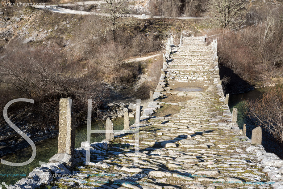 Landscape of Ancient Bridge of Missios in Vikos gorge and Pindus Mountains, Zagori, Epirus, Greece