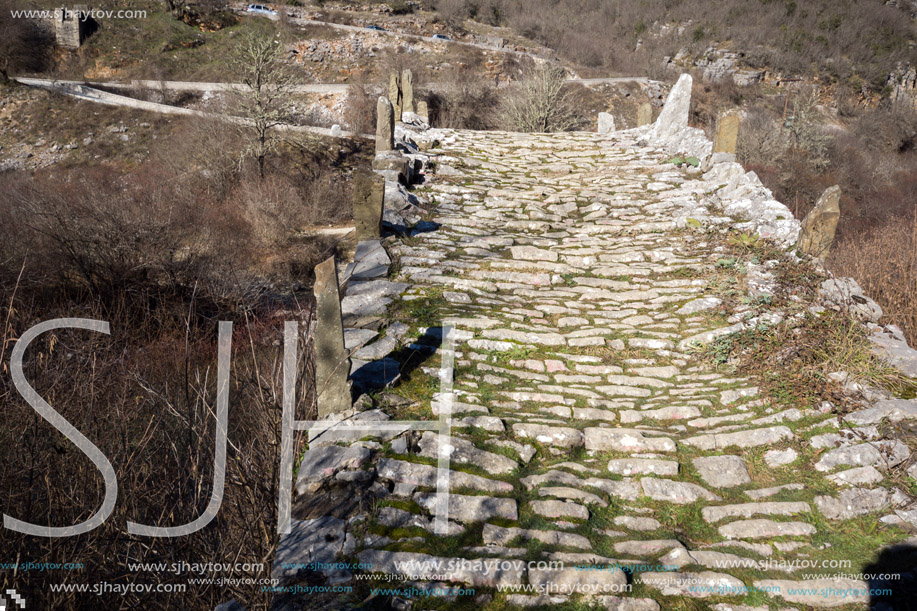 Landscape of Ancient Bridge of Missios in Vikos gorge and Pindus Mountains, Zagori, Epirus, Greece